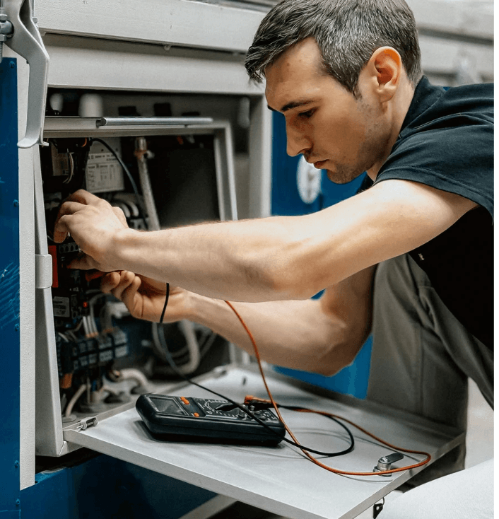 HVAC repair services technician working on a system